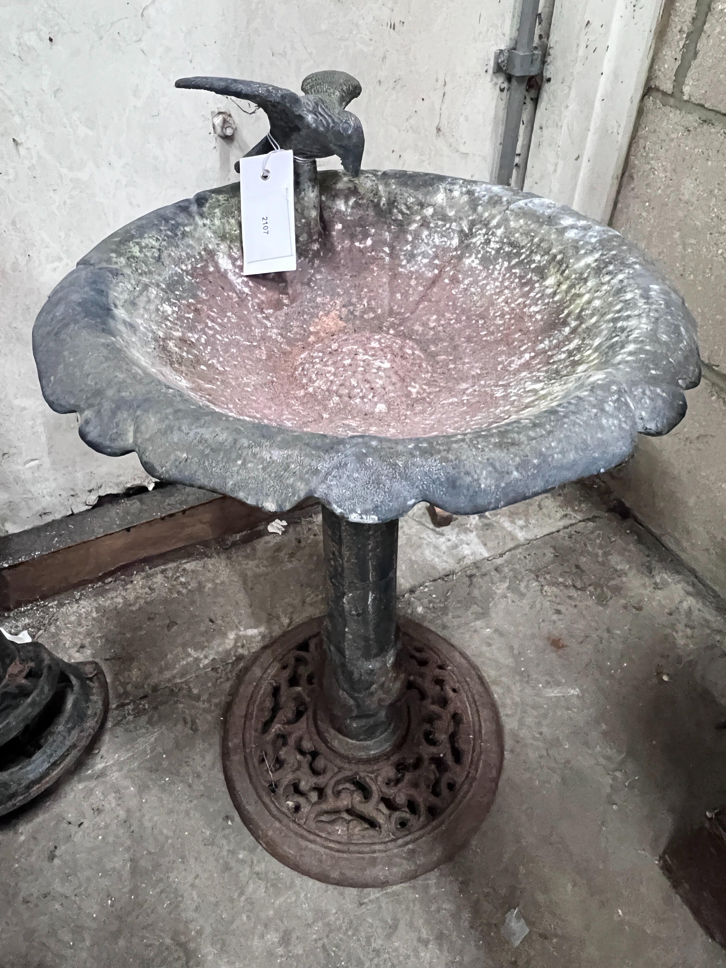 An aluminium bird bath, height 52cm together with a Victorian style water pump